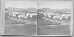 SA0407b - A general view of buildings associated with the Second Family, a road, and fences. Identified on the front.